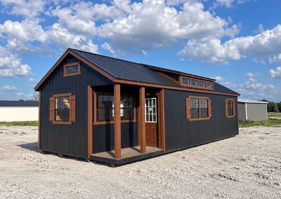 Beautiful cabin with dormers, loft, mini front porch and lots of windows