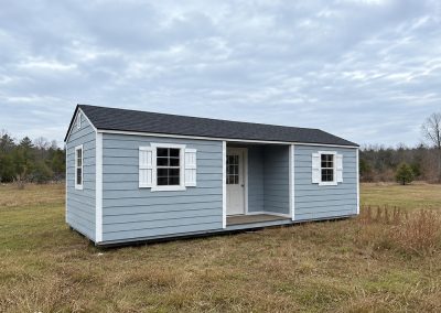 Blue colored wooden cabin used as a hunting retreat