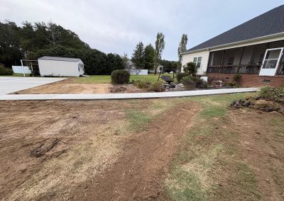 Concrete sidewalk attached to a pad