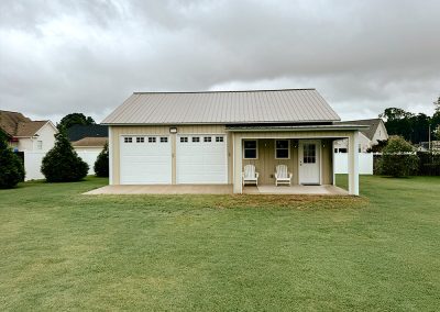 Double car garage building with overhang and white trim