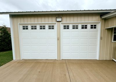 Double garage building with electric and walkway overhang