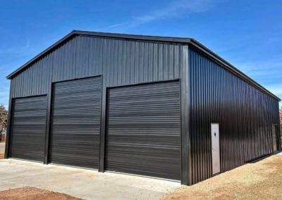 Metal barn with hay storage lean-to on a North Carolina farm