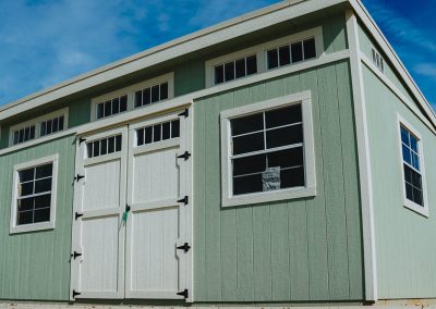 Premium sun studio with painted siding and double doors