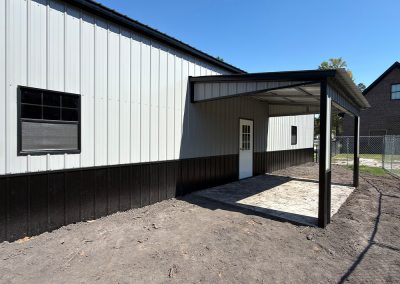 Steel RV cover with vertical roof panels