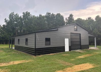 Steel barn dominium with porch and windows